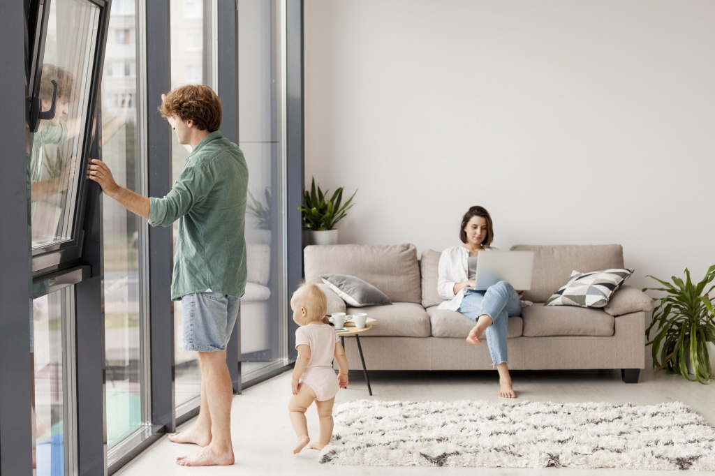 full-shot-couple-with-baby-living-room.jpg